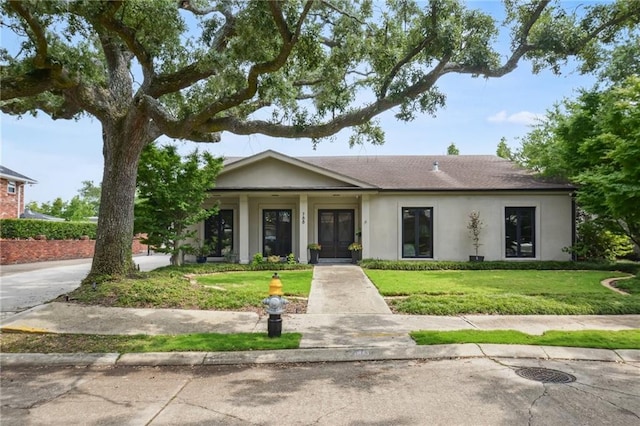 788 Amethyst St, New Orleans, LA 70124 - view of front of home featuring stucco siding and a front yard
