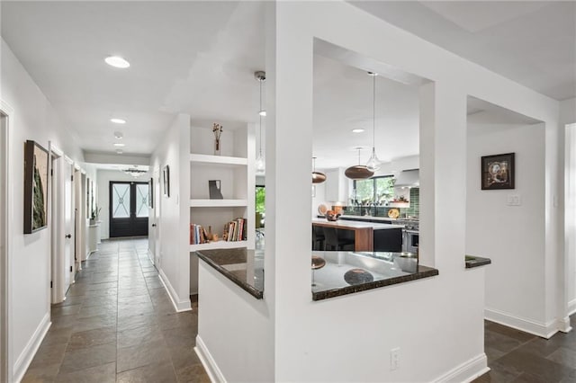 788 Amethyst St, New Orleans, LA 70124 - hall featuring stone tile floors, baseboards, and recessed lighting