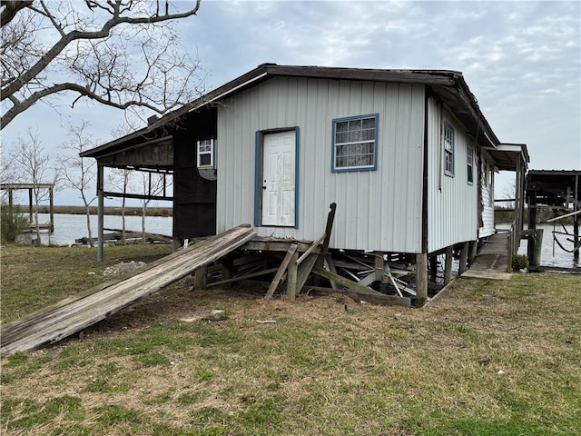 2861 Ridgeway Blvd, New Orleans, LA 70129 - view of front of home with a water view and a front lawn