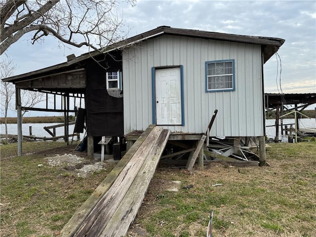 2861 Ridgeway Blvd, New Orleans, LA 70129 - view of outbuilding with a water view and entry steps