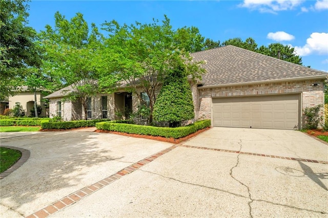 1132 Hardy Dr, Covington, LA 70433 - view of front facade featuring concrete driveway, brick siding, an attached garage, and a shingled roof