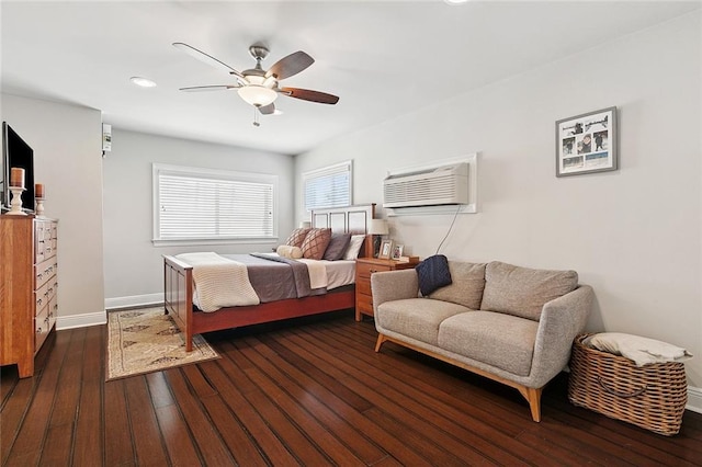 613 Andrews Ave, Metairie, LA 70005 - bedroom with an AC wall unit, dark wood-style flooring, baseboards, a ceiling fan, and recessed lighting