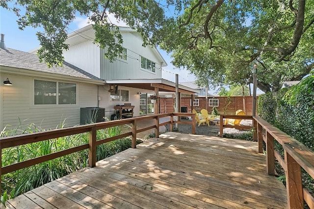 613 Andrews Ave, Metairie, LA 70005 - wooden deck featuring central AC unit