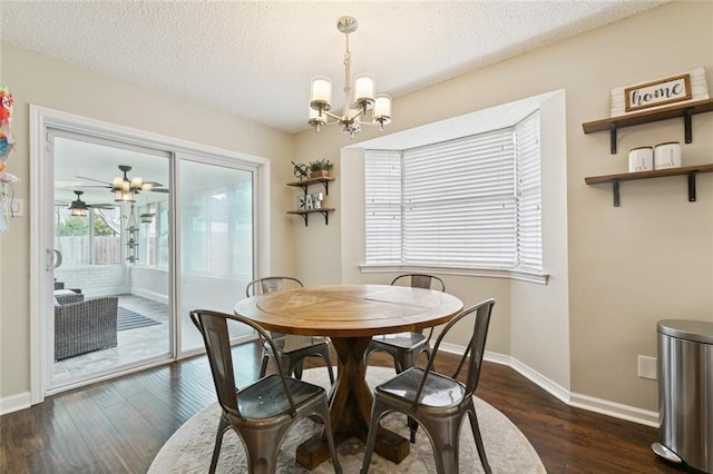 4212 Pommard Dr, Kenner, LA 70065 - dining space featuring a chandelier, dark wood-style floors, baseboards, a textured ceiling, and ceiling fan
