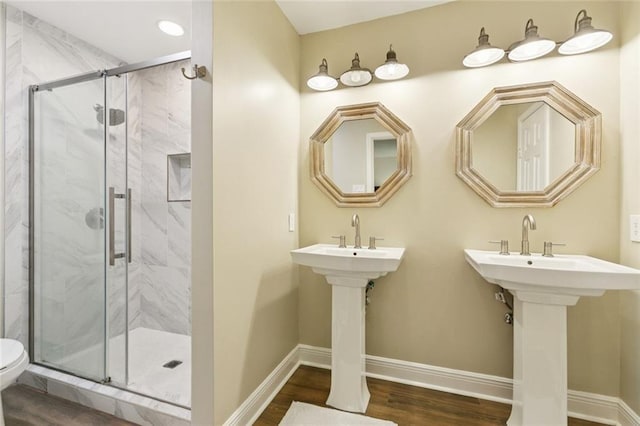 4212 Pommard Dr, Kenner, LA 70065 - full bathroom with toilet, a marble finish shower, wood finished floors, baseboards, and recessed lighting