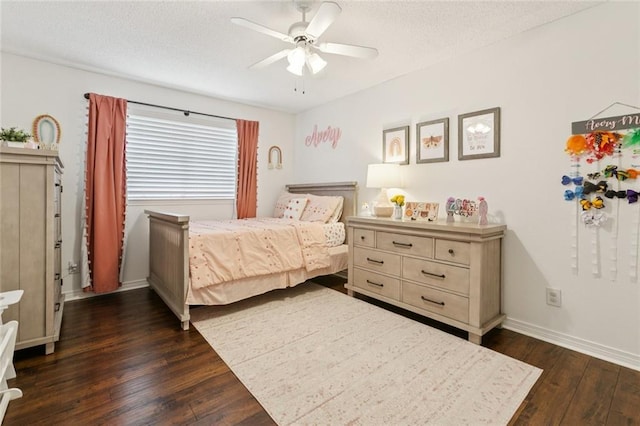 4212 Pommard Dr, Kenner, LA 70065 - bedroom featuring dark wood finished floors, a textured ceiling, ceiling fan, and baseboards