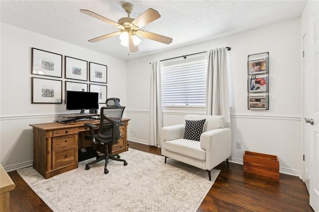 4212 Pommard Dr, Kenner, LA 70065 - office with dark wood-type flooring, a textured ceiling, a ceiling fan, and baseboards