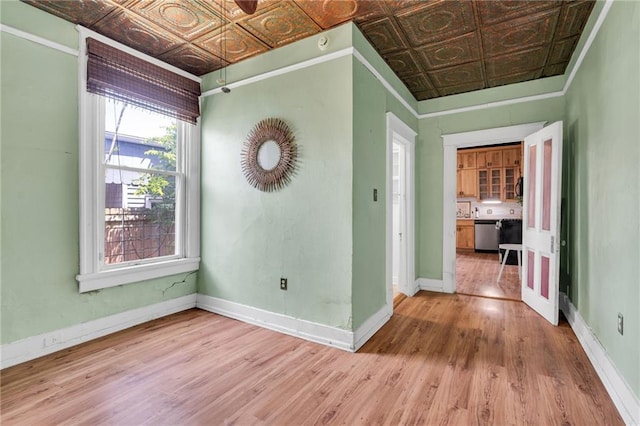 8301 Belfast St Unit 8303, New Orleans, LA 70118 - empty room with an ornate ceiling, wood finished floors, baseboards, and ornamental molding