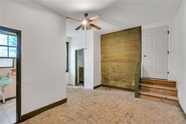8301 Belfast St Unit 8303, New Orleans, LA 70118 - spare room featuring ceiling fan and baseboards