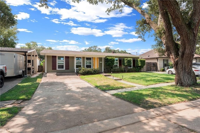 6416 Nora St, Metairie, LA 70003 - ranch-style home featuring concrete driveway and a front yard