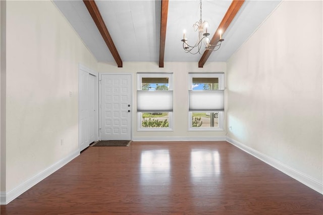 6416 Nora St, Metairie, LA 70003 - spare room featuring dark wood-style floors and a chandelier