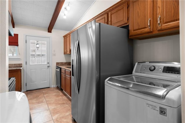 6416 Nora St, Metairie, LA 70003 - laundry room featuring washer / clothes dryer and light tile patterned floors