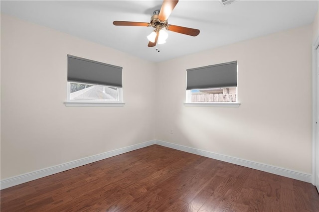 6416 Nora St, Metairie, LA 70003 - empty room featuring healthy amount of natural light, wood finished floors, and a ceiling fan