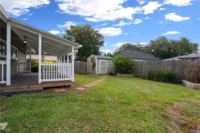 6416 Nora St, Metairie, LA 70003 - fenced backyard featuring a storage shed and a wooden deck