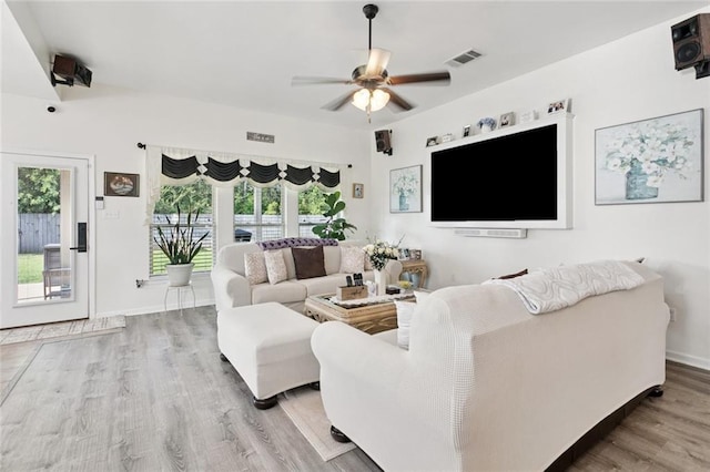 728 Fairfield Loop, Slidell, LA 70458 - living room featuring wood finished floors, a ceiling fan, and baseboards