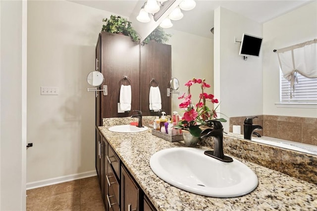 728 Fairfield Loop, Slidell, LA 70458 - bathroom with double vanity, tile patterned floors, baseboards, and a chandelier