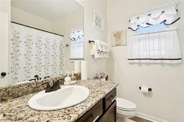 728 Fairfield Loop, Slidell, LA 70458 - full bath featuring vanity, plenty of natural light, toilet, and baseboards