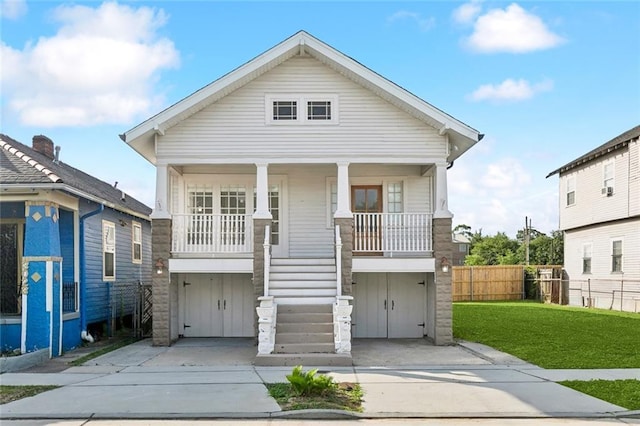 3019 Burdette St, New Orleans, LA 70125 - view of front of house featuring covered porch, driveway, and stairway