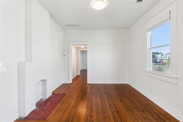 3019 Burdette St, New Orleans, LA 70125 - empty room with dark wood-style floors and baseboards