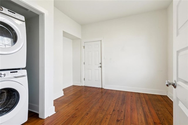 3019 Burdette St, New Orleans, LA 70125 - washroom with estacked washer and dryer, wood-type flooring, and baseboards