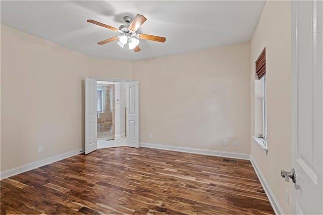 816 Celeste Ave, River Ridge, LA 70123 - empty room featuring a ceiling fan, dark wood finished floors, and baseboards