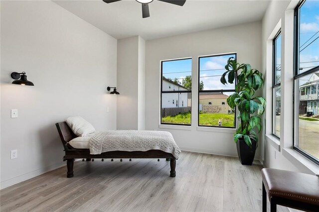 2404 Danneel St, New Orleans, LA 70113 - bedroom featuring light wood-style floors, ceiling fan, and baseboards