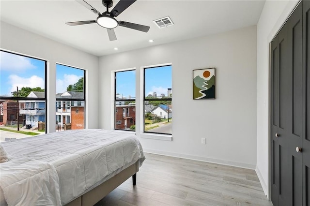 2404 Danneel St, New Orleans, LA 70113 - bedroom featuring light wood finished floors, recessed lighting, baseboards, and ceiling fan