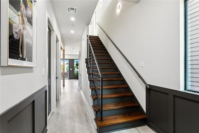 2404 Danneel St, New Orleans, LA 70113 - stairway with wood finished floors and recessed lighting