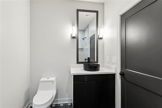 2404 Danneel St, New Orleans, LA 70113 - bathroom featuring vanity, toilet, and baseboards