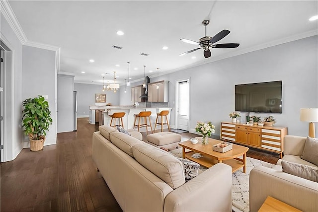 615 Newman Ave, Jefferson, LA 70121 - living room with crown molding, recessed lighting, ceiling fan, dark wood-style flooring, and baseboards