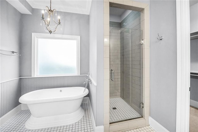 615 Newman Ave, Jefferson, LA 70121 - full bath with a shower stall, a freestanding bath, a chandelier, crown molding, and baseboards