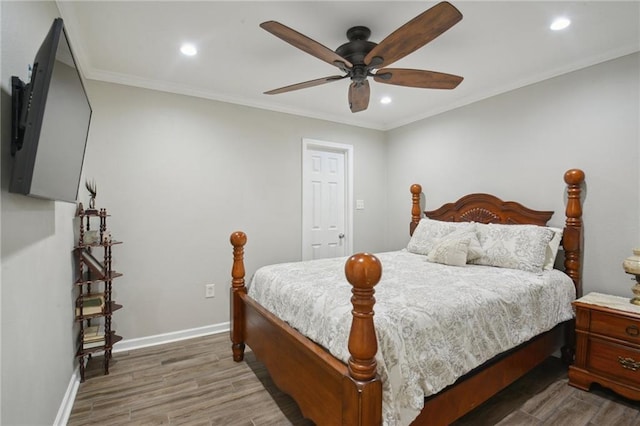 133 Creagan Ave, Gretna, LA 70053 - bedroom featuring wood finished floors, recessed lighting, baseboards, ceiling fan, and ornamental molding