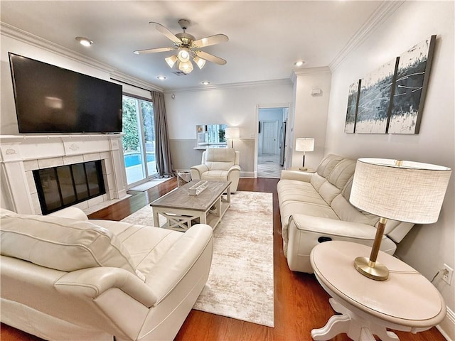 44 Stonebridge Ct, Mandeville, LA 70448 - living room with crown molding, wood finished floors, a ceiling fan, a fireplace, and recessed lighting