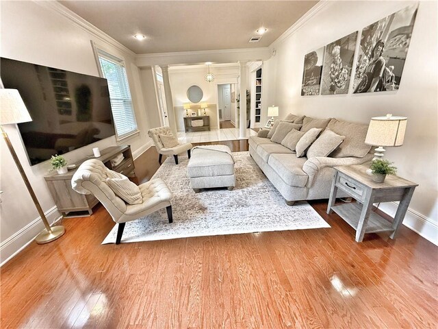 44 Stonebridge Ct, Mandeville, LA 70448 - living area featuring ornamental molding, wood finished floors, and ornate columns