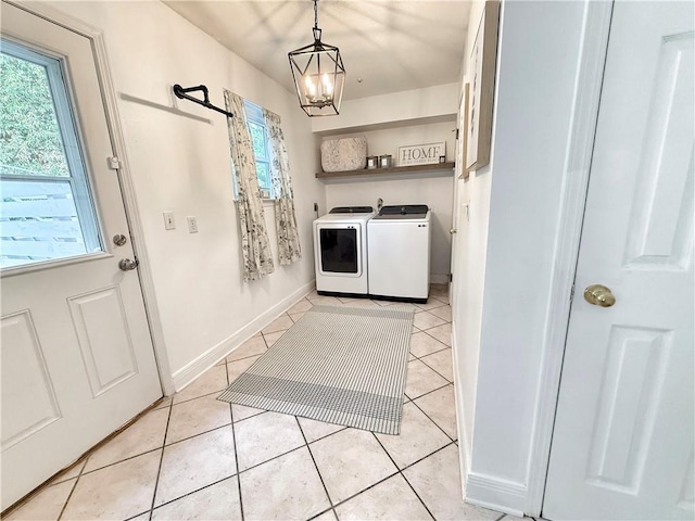 44 Stonebridge Ct, Mandeville, LA 70448 - washroom featuring washer and dryer, plenty of natural light, a chandelier, and light tile patterned flooring