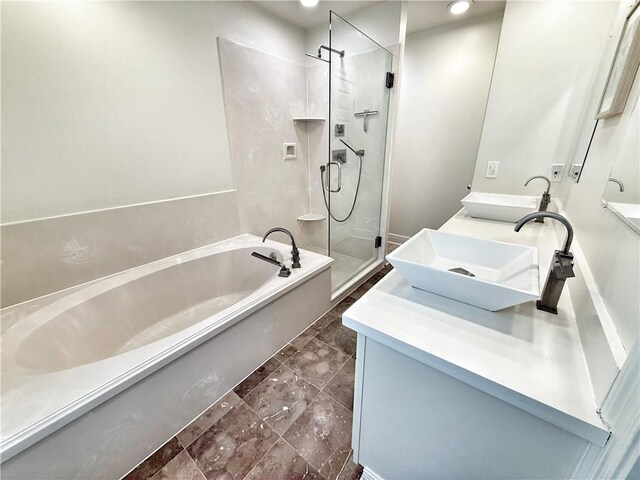 44 Stonebridge Ct, Mandeville, LA 70448 - full bath with double vanity, a garden tub, a shower stall, and recessed lighting