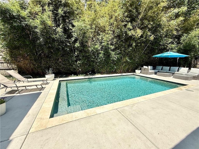 44 Stonebridge Ct, Mandeville, LA 70448 - swimming pool with a patio and an outdoor living space