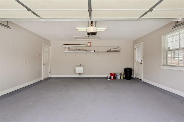 3513 9th St, Metairie, LA 70002 - garage with baseboards and a garage door opener