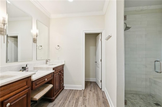 5714 Vicksburg St, New Orleans, LA 70124 - full bath featuring double vanity, a shower stall, wood finished floors, ornamental molding, and baseboards