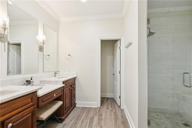 5714 Vicksburg St, New Orleans, LA 70124 - full bath featuring double vanity, a stall shower, wood finished floors, crown molding, and baseboards