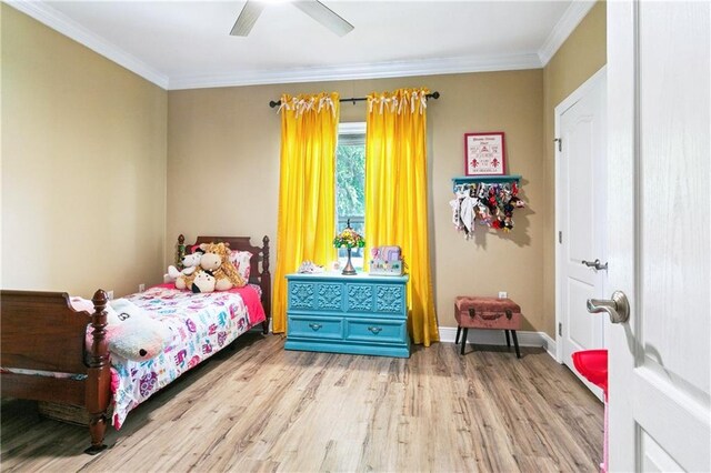 5714 Vicksburg St, New Orleans, LA 70124 - bedroom featuring wood finished floors, crown molding, baseboards, and ceiling fan