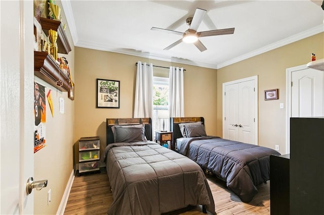 5714 Vicksburg St, New Orleans, LA 70124 - bedroom featuring wood finished floors, ornamental molding, baseboards, ceiling fan, and a closet