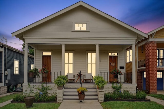 718 Monroe St, Gretna, LA 70053 - view of front of house with a porch