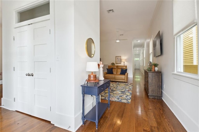 718 Monroe St, Gretna, LA 70053 - hallway with wood finished floors, baseboards, and crown molding