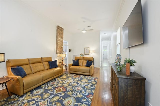 718 Monroe St, Gretna, LA 70053 - living area with wood finished floors, ceiling fan, ornamental molding, and baseboards