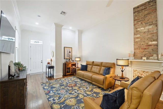 718 Monroe St, Gretna, LA 70053 - living area featuring wood finished floors, crown molding, and recessed lighting