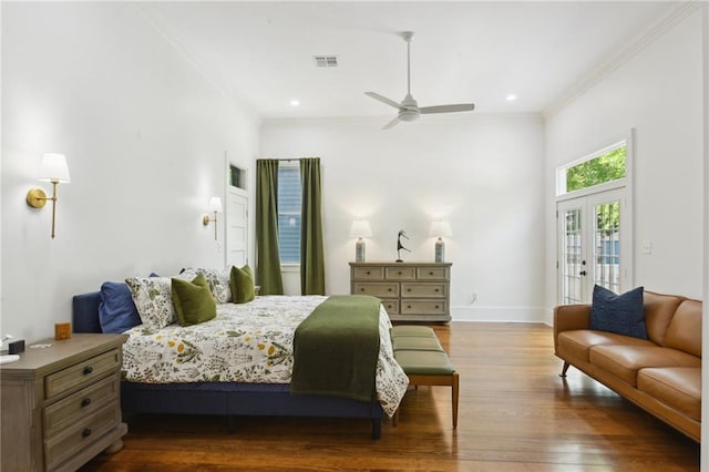 718 Monroe St, Gretna, LA 70053 - bedroom with dark wood-style floors, crown molding, french doors, baseboards, and recessed lighting