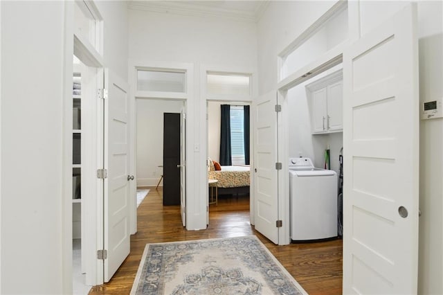 718 Monroe St, Gretna, LA 70053 - laundry area featuring washer / clothes dryer, dark wood finished floors, cabinet space, crown molding, and a high ceiling