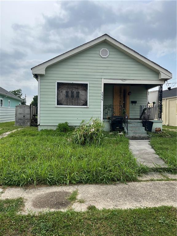 1717 Egania St, New Orleans, LA 70117 - view of front of property featuring a porch