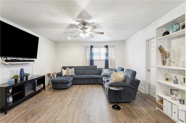 6909 Asher St, Metairie, LA 70003 - living room with a ceiling fan, light wood finished floors, and recessed lighting